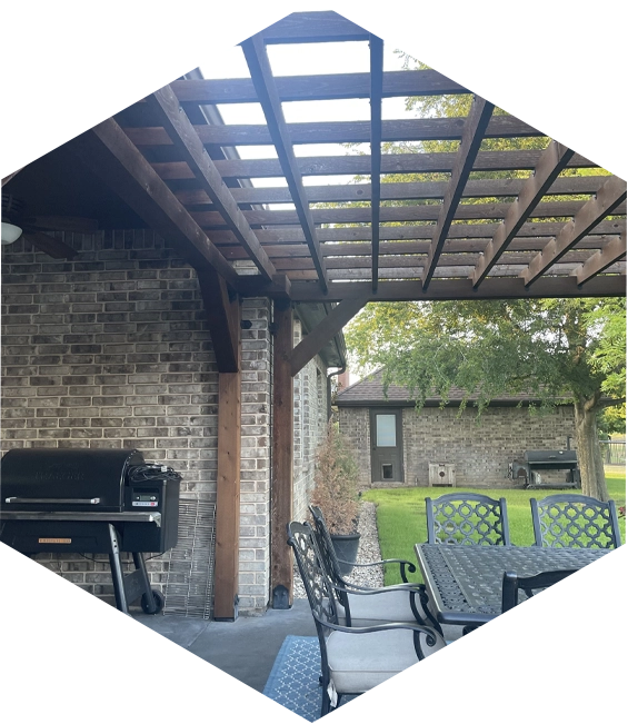 A patio with chairs and an open roof