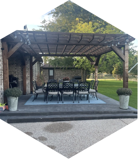 Outdoor patio with pergola and dining set.