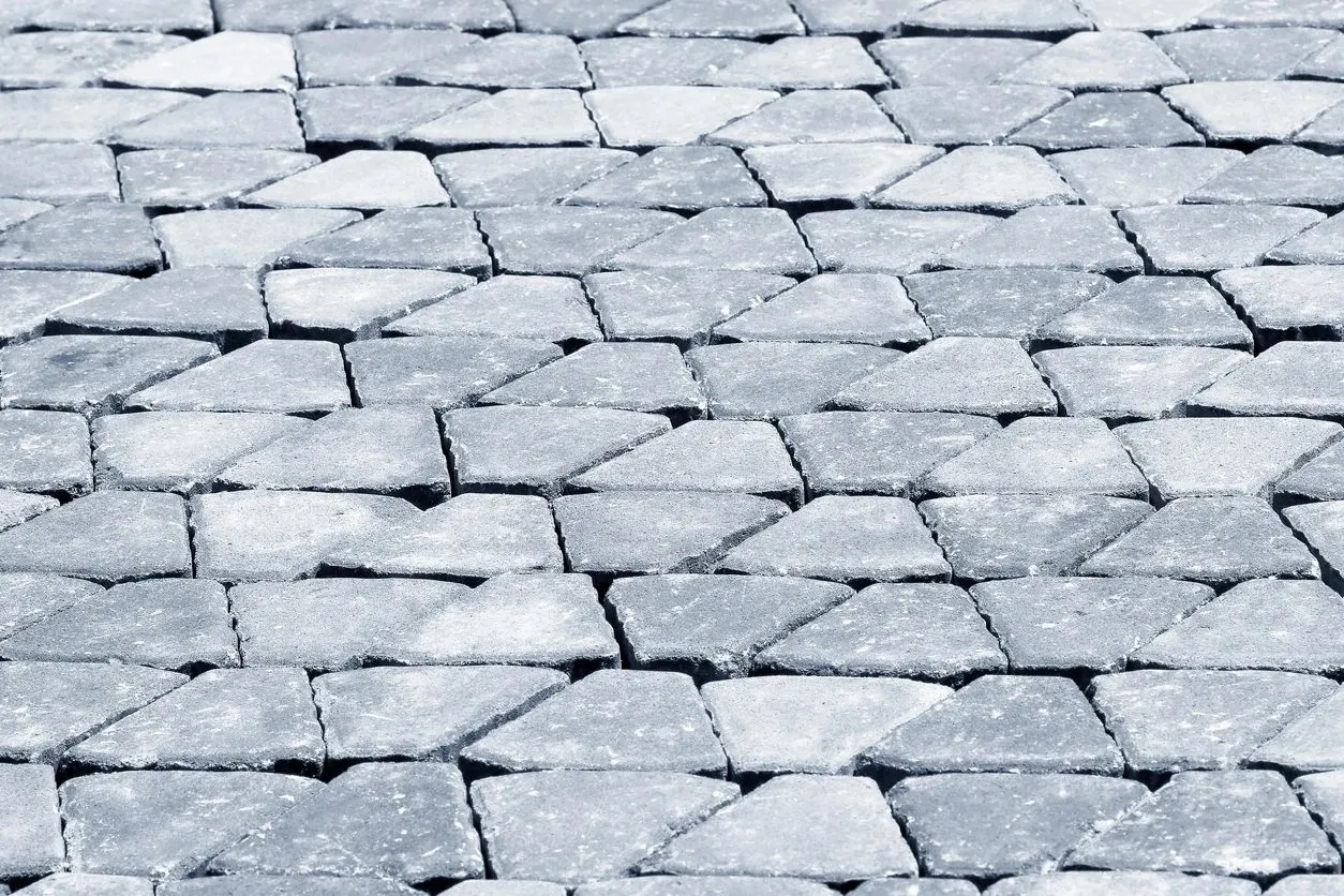 A close up of the pavement that is made from blocks